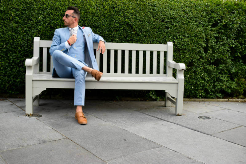 Summer suit relaxing on a park bench