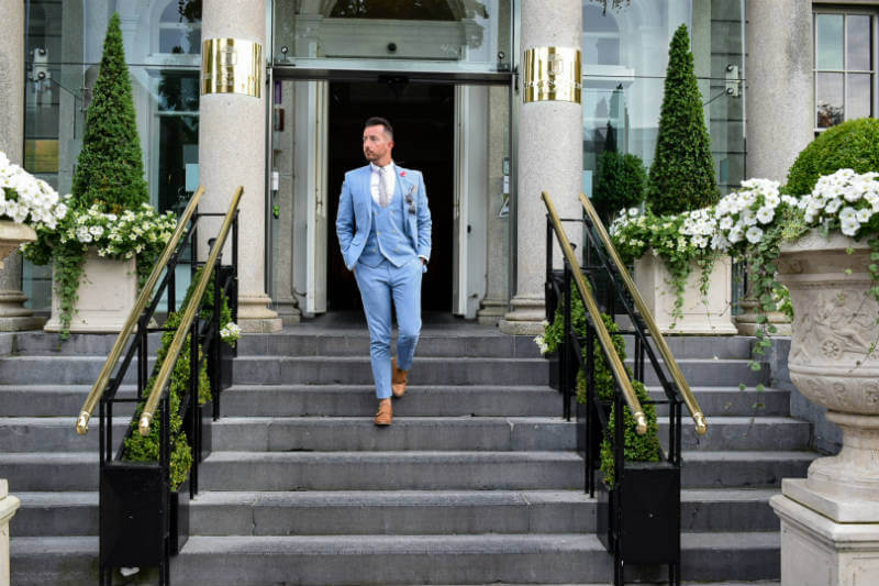 Summer suit walking down steps